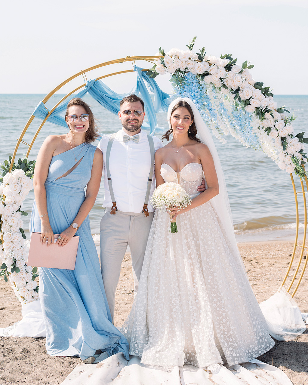 Tender wedding photo with flowers and arch